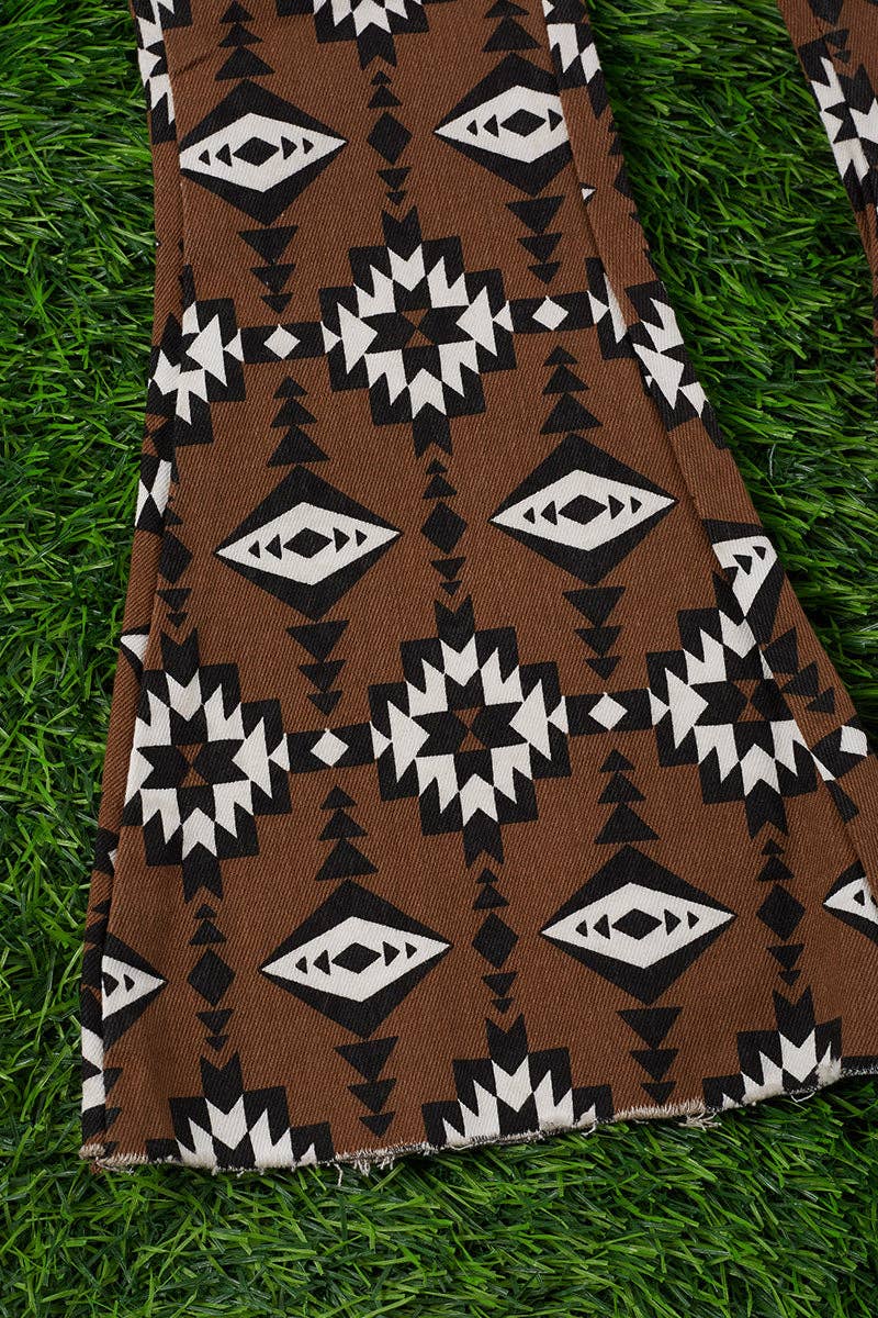Brown aztec printed bootcut denim pants. PNG25153091 amy